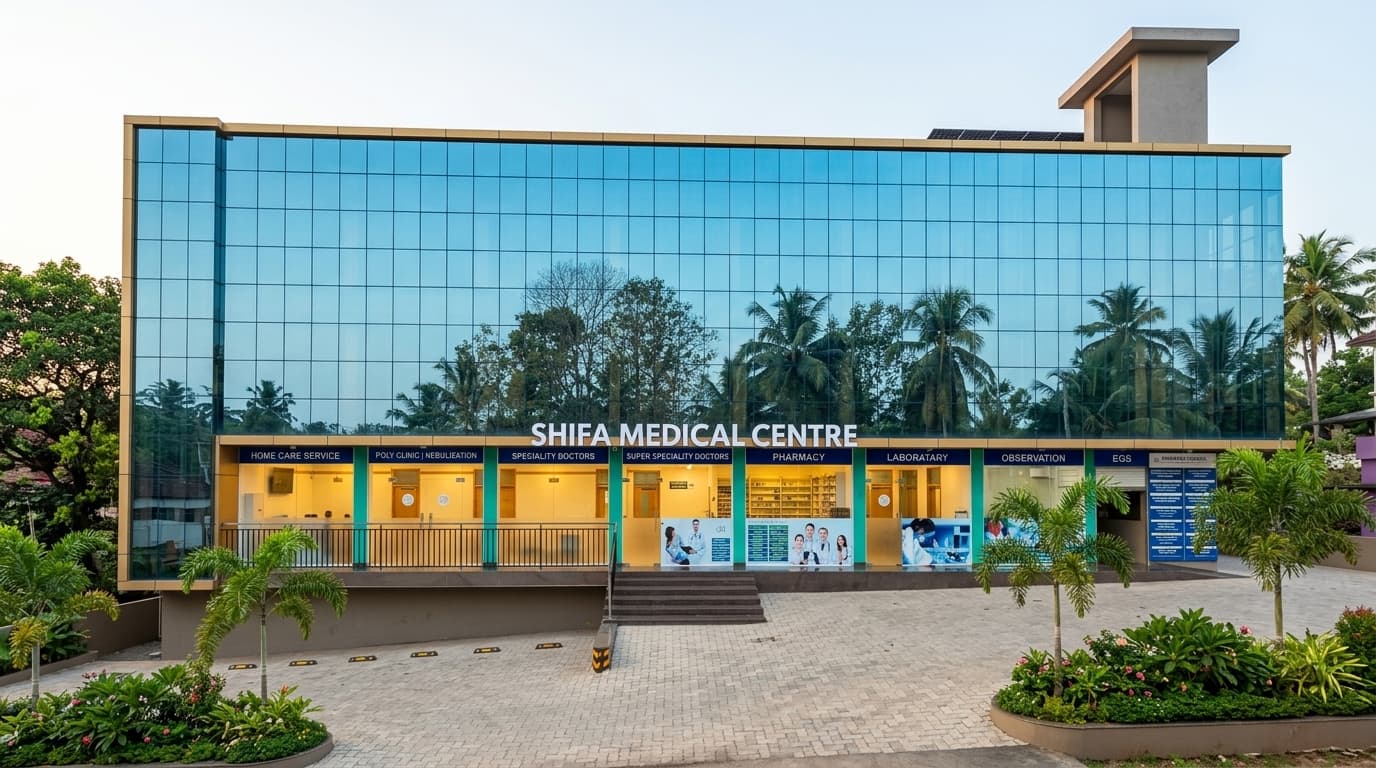 Shifa Medical Centre from the road — the glass frontage with the department signboard running across the ground floor